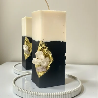 Devotion Luxury handmade crystal candle with natural gemstones, black sculpted base and gold accents, minimalist interior décor