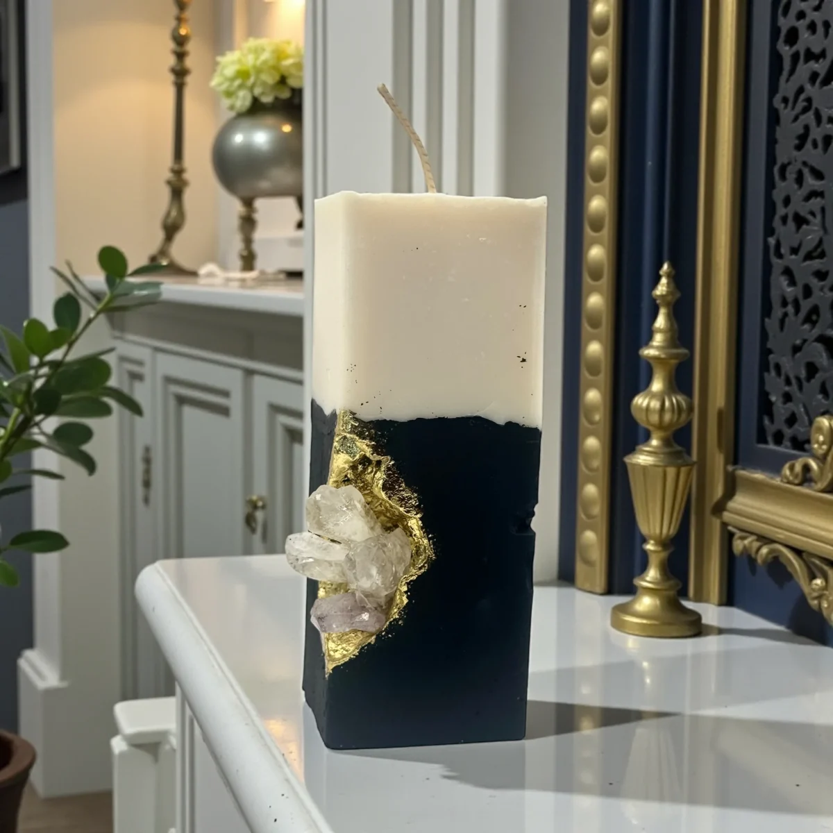 Devotion Luxury handmade crystal candle with natural gemstones, black sculpted base and gold accents, minimalist interior décor